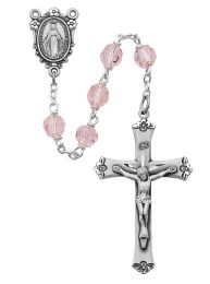 7mm pink tin cut crystal beads with sterling center and crucifix.  Deluxe gift boxed.