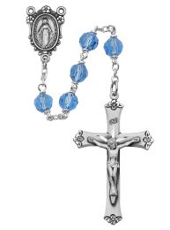 7mm blue tin cut crystal beads with sterling center and crucifix.  Deluxe gift boxed.